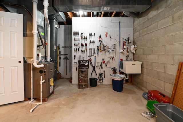 unfinished basement featuring a workshop area