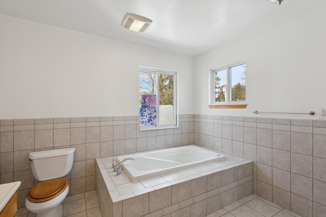 bathroom with a garden tub, tile walls, toilet, and tile patterned floors