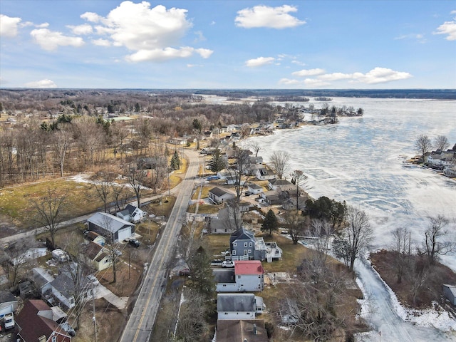 birds eye view of property with a water view and a residential view