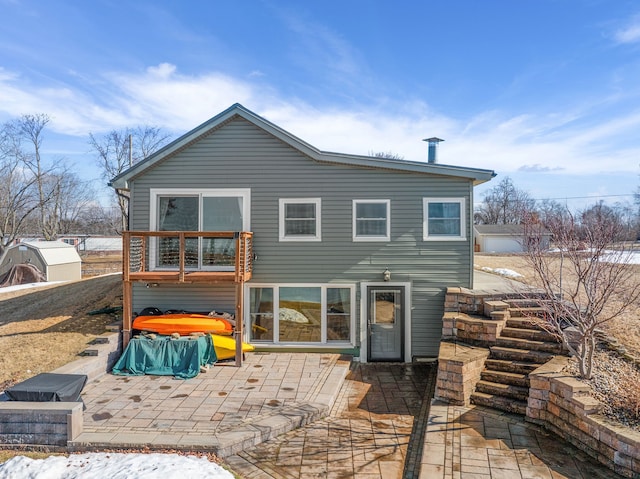 back of property featuring a patio area