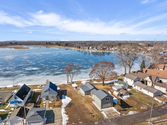 drone / aerial view featuring a residential view and a water view