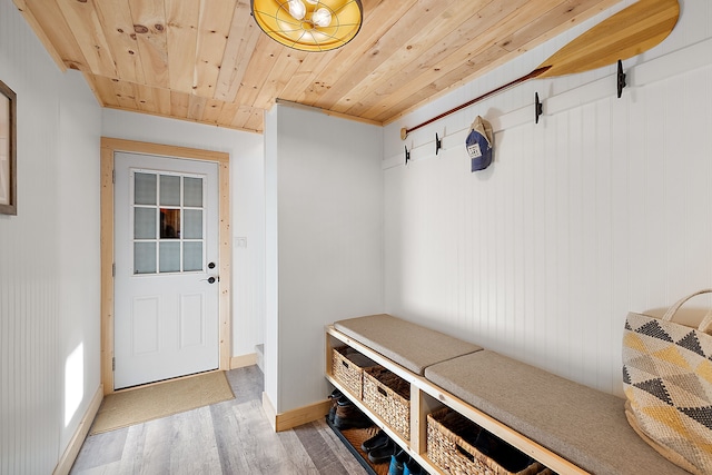 mudroom featuring wooden ceiling, light wood finished floors, and baseboards