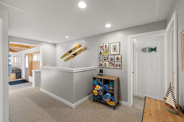 corridor featuring carpet floors, recessed lighting, and baseboards