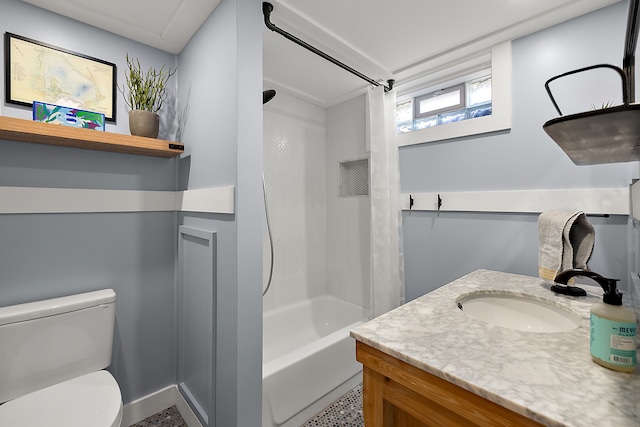 bathroom with toilet, vanity, and shower / bathtub combination