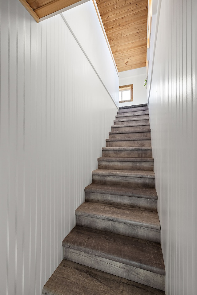 stairway featuring wood ceiling