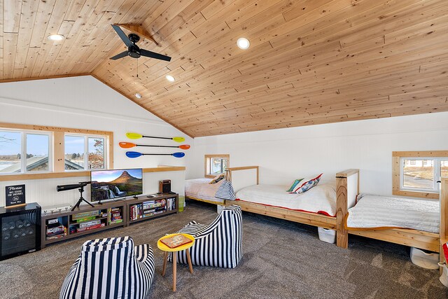 bedroom featuring carpet, wooden ceiling, multiple windows, and lofted ceiling