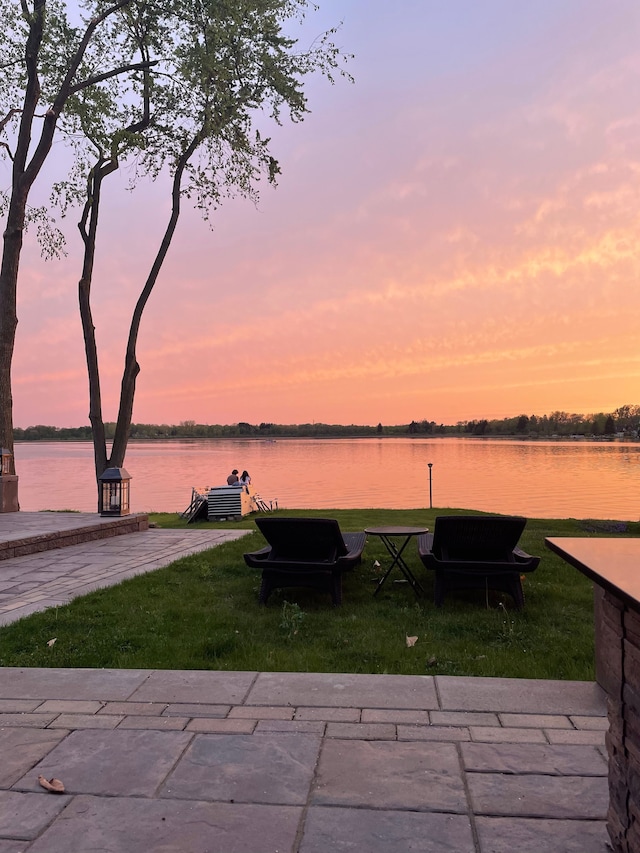 exterior space with a yard and a water view