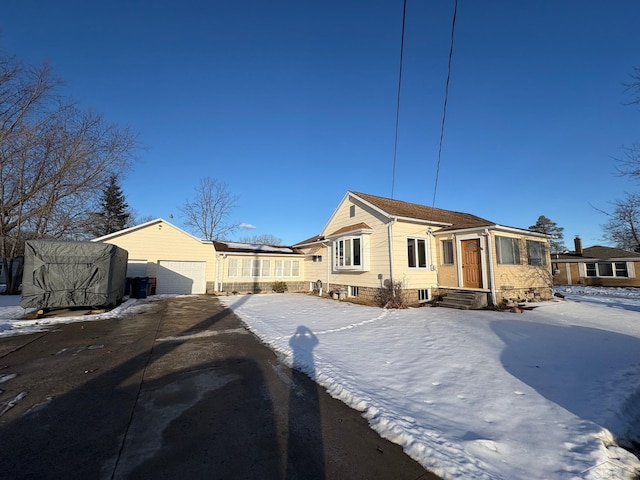 bungalow-style home featuring a detached garage