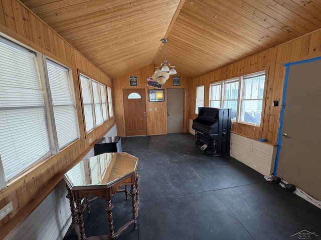 sunroom / solarium featuring wooden ceiling and vaulted ceiling