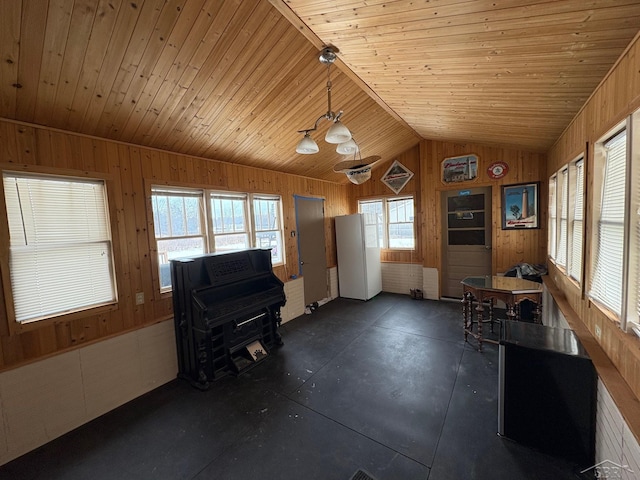 unfurnished sunroom featuring lofted ceiling and wood ceiling