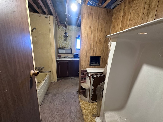 full bath with a sink and a bathing tub