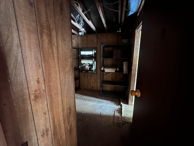 hallway with wood walls