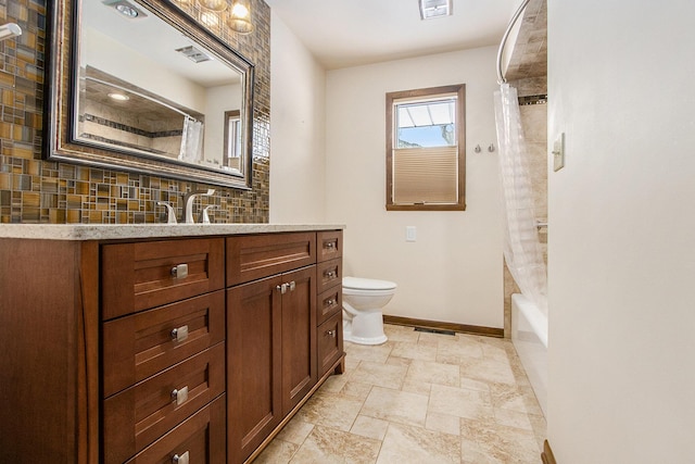 full bath with toilet, vanity, visible vents, baseboards, and tasteful backsplash