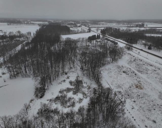 snowy aerial view with a rural view