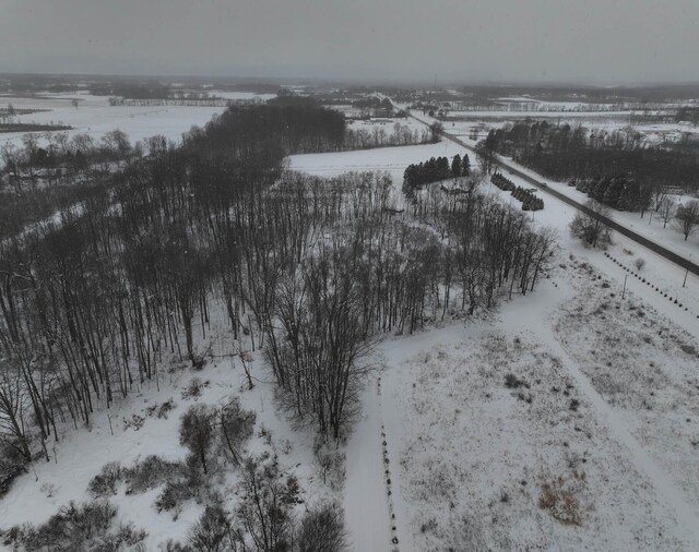 snowy aerial view with a rural view