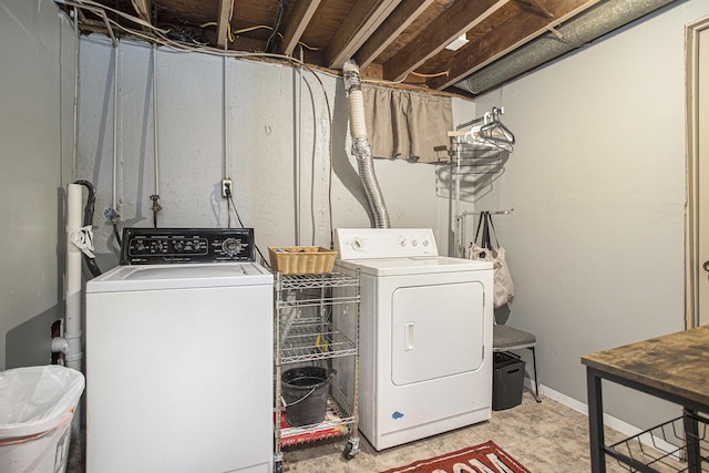 clothes washing area featuring laundry area and separate washer and dryer