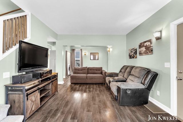 living area featuring dark wood-style floors and baseboards