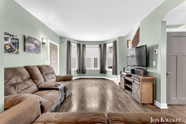 living room with hardwood / wood-style flooring and baseboards