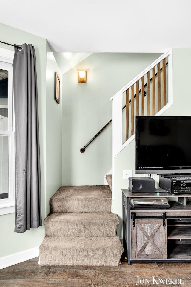 stairway with wood finished floors