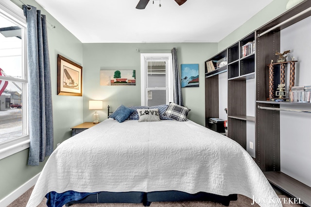 bedroom featuring ceiling fan and baseboards