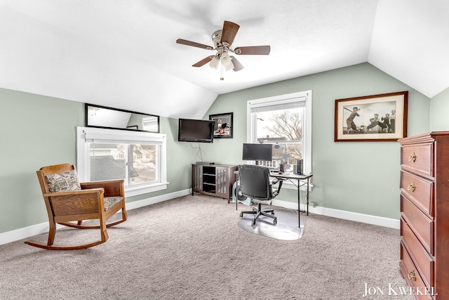 office space featuring vaulted ceiling, carpet floors, ceiling fan, and baseboards