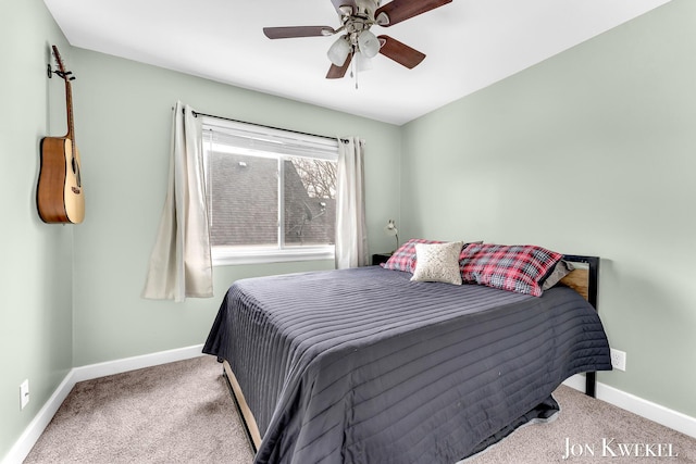 bedroom with carpet floors, baseboards, and a ceiling fan