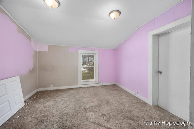 bonus room featuring carpet floors, vaulted ceiling, and baseboards