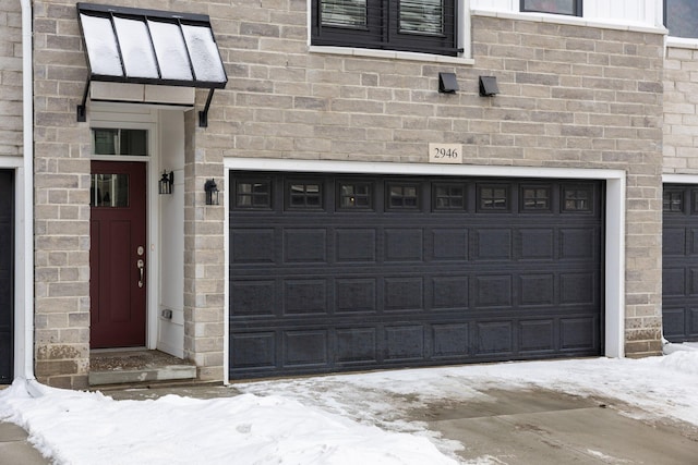 view of snow covered garage