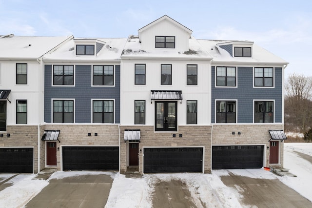 multi unit property featuring an attached garage