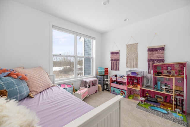 bedroom featuring light carpet