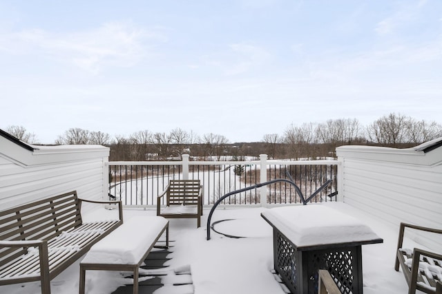 view of snow covered deck