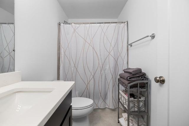 bathroom with toilet, tile patterned flooring, a shower with shower curtain, and vanity