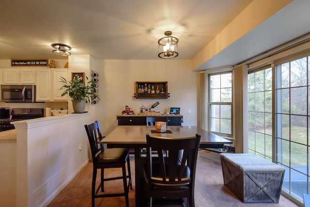 dining area featuring an inviting chandelier