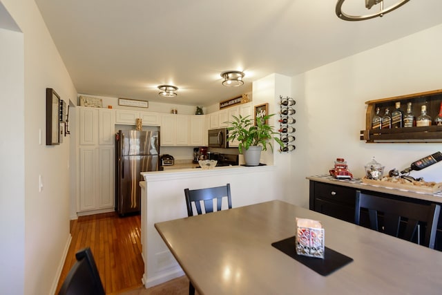 dining room with dark wood-style floors