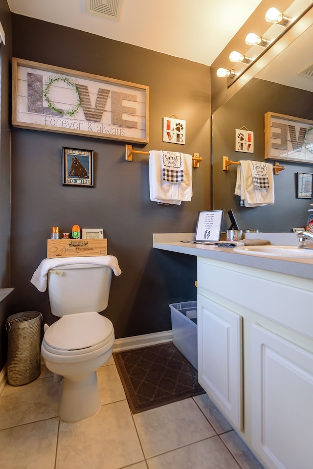 bathroom with visible vents, toilet, tile patterned flooring, and vanity