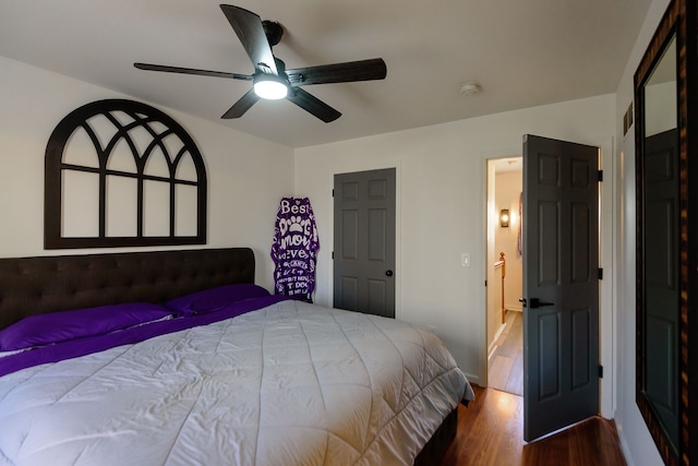 bedroom with a ceiling fan and wood finished floors