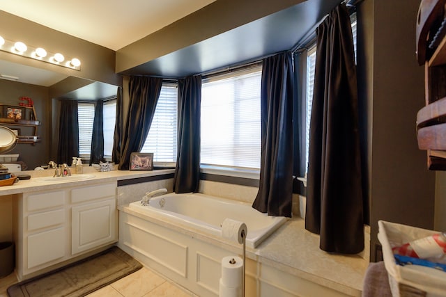 full bath featuring vanity, a bath, and tile patterned floors