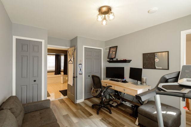 office featuring visible vents and light wood-style floors