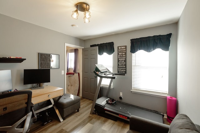 workout room with light wood-type flooring