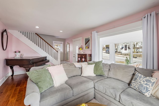 living room with recessed lighting, stairs, baseboards, and wood finished floors