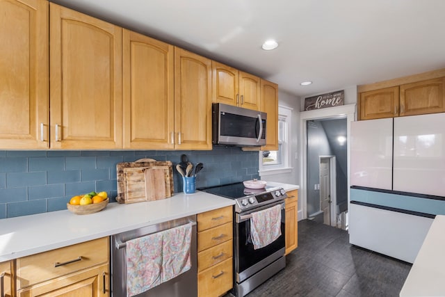 kitchen with tasteful backsplash, light brown cabinetry, light countertops, recessed lighting, and appliances with stainless steel finishes