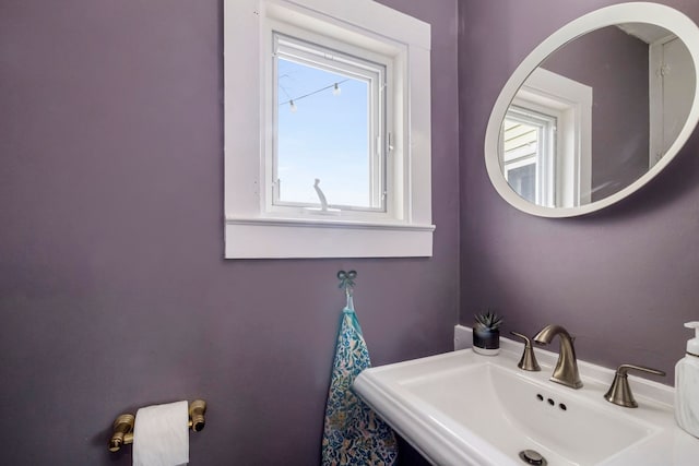 bathroom featuring a sink and a wealth of natural light