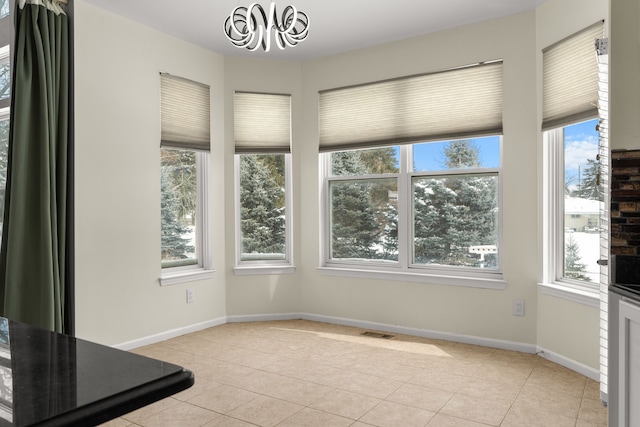 35316 Burgundy, Sterling Heights, MI 48312 - unfurnished dining area featuring light tile patterned floors, plenty of natural light, visible vents, and baseboards
