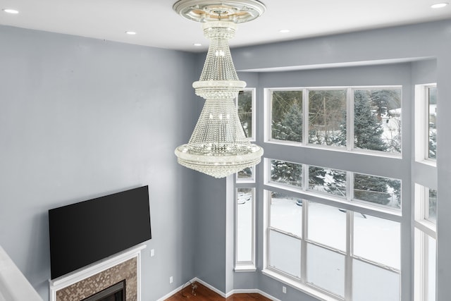 35316 Burgundy, Sterling Heights, MI 48312 - room details featuring recessed lighting, baseboards, a notable chandelier, and a high end fireplace