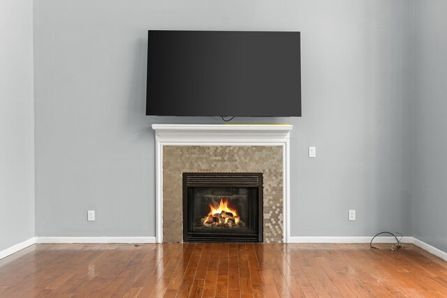 35316 Burgundy, Sterling Heights, MI 48312 - room details featuring a fireplace, baseboards, and wood finished floors