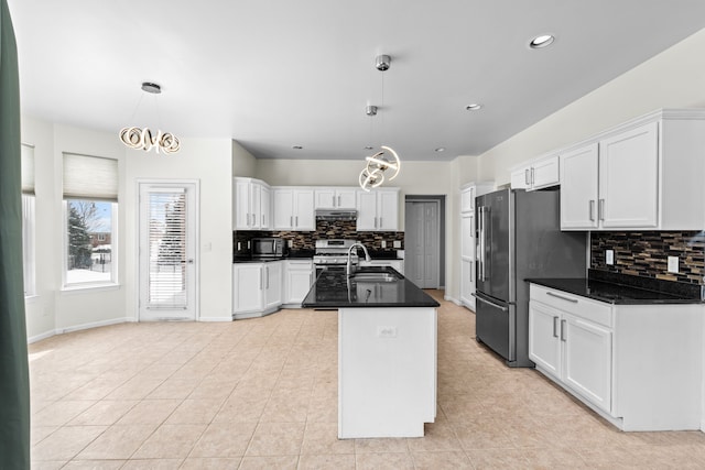 35316 Burgundy, Sterling Heights, MI 48312 - kitchen with dark countertops, a kitchen island with sink, white cabinetry, and decorative light fixtures