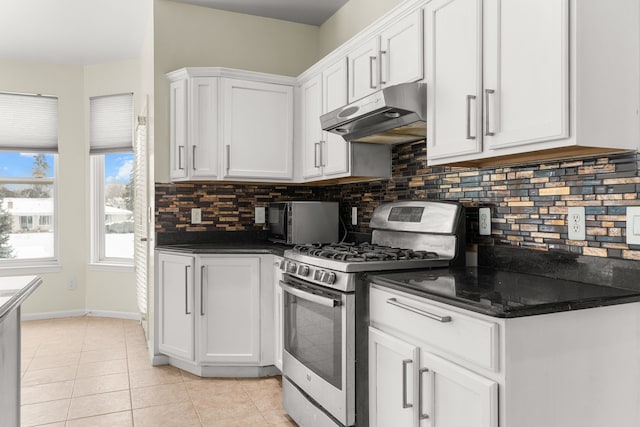 35316 Burgundy, Sterling Heights, MI 48312 - kitchen with light tile patterned floors, stainless steel gas stove, under cabinet range hood, and white cabinetry