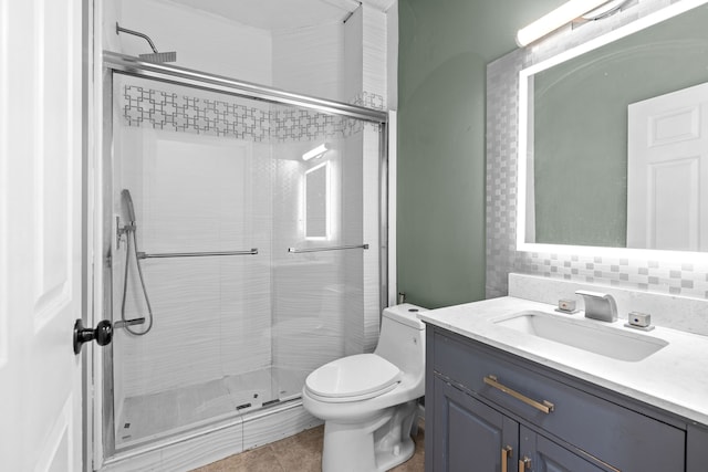35316 Burgundy, Sterling Heights, MI 48312 - bathroom with a stall shower, toilet, vanity, and decorative backsplash
