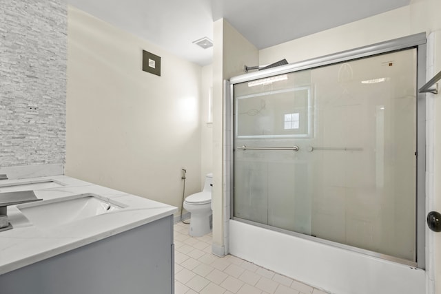 35316 Burgundy, Sterling Heights, MI 48312 - bathroom with double vanity, visible vents, toilet, enclosed tub / shower combo, and a sink