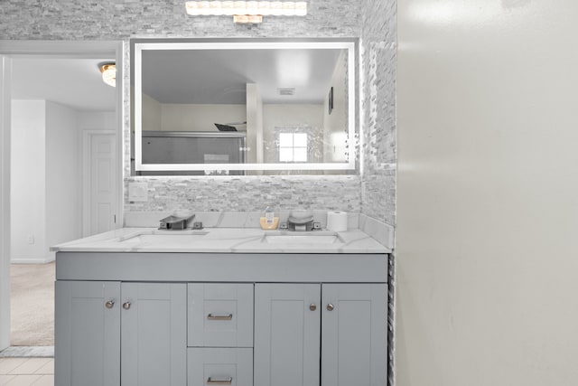 35316 Burgundy, Sterling Heights, MI 48312 - full bathroom featuring double vanity, tasteful backsplash, and a sink